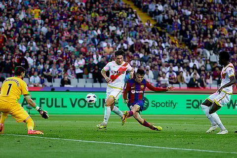 Pedri, right, scores his side's 3rd goal